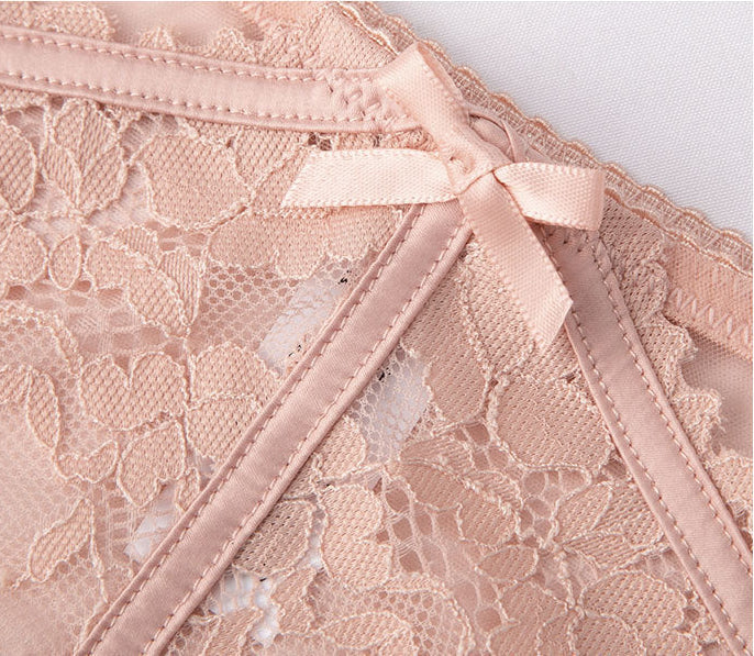 Close-up of bow accent and lace embroidery detail on pink mesh panty - Seriva Lingerie